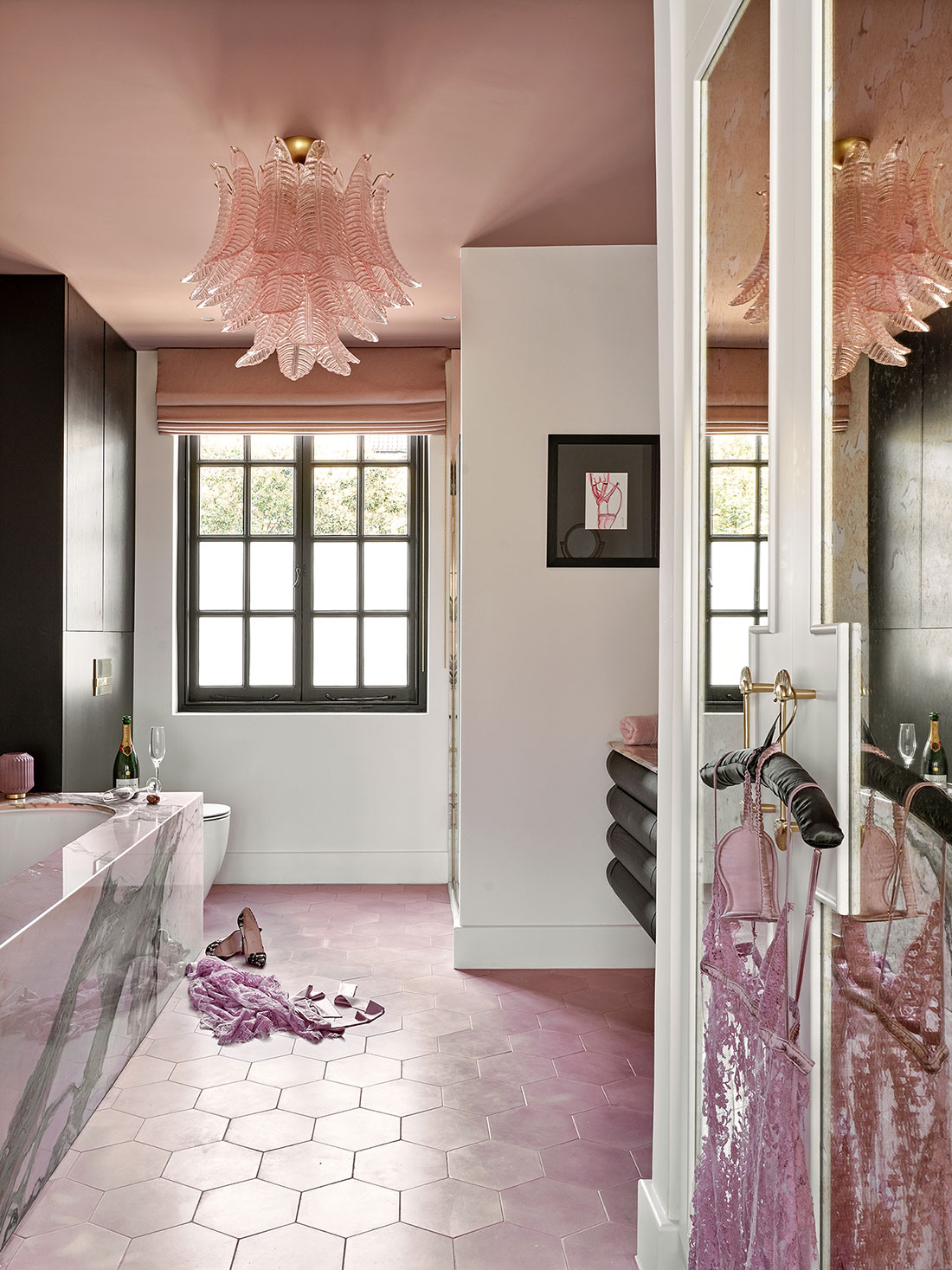 The luxury bathroom from LEIVARS project in St John's Wood featuring pink marble bath